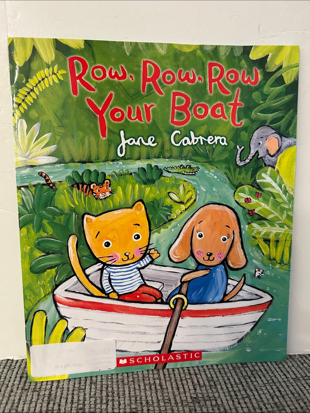 Row, Row, Row Your Boat book written by Jane Cabrera kitten puppy
